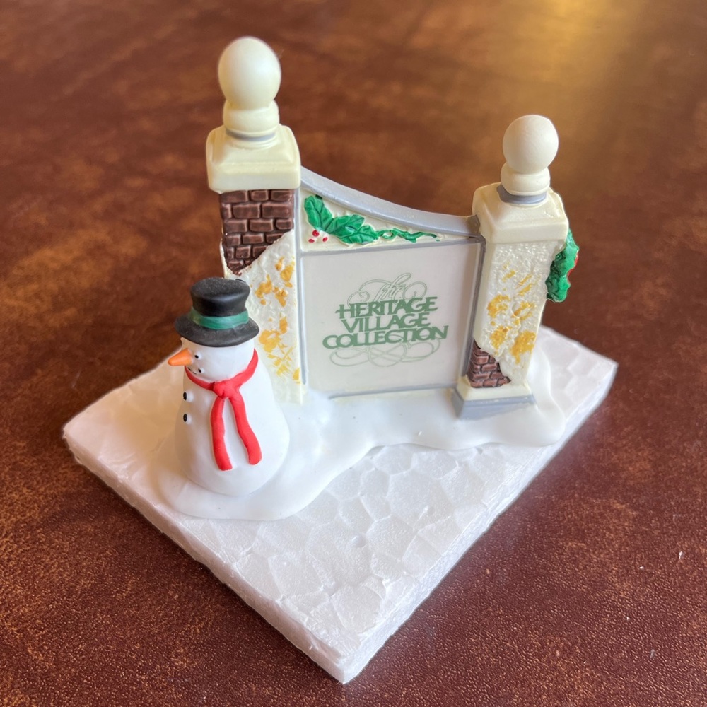 Dept 56 - The Heritage Village Collection - “Village Sign with Snowman”